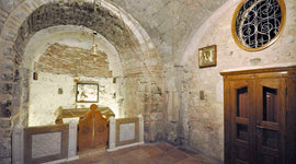 Panoramic image of the altar in the Chapel of Adam and the stone behind it