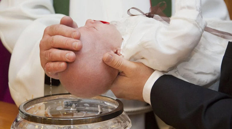 Baby Baptized with Holy Water