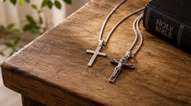 Plain cross and crucifix necklaces side by side for a Catholic wearing decision