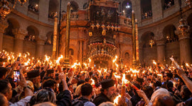 Christians celebrate Easter beside the traditional tomb of Jesus at the Church of the Holy Sepulchre in Jerusalem.