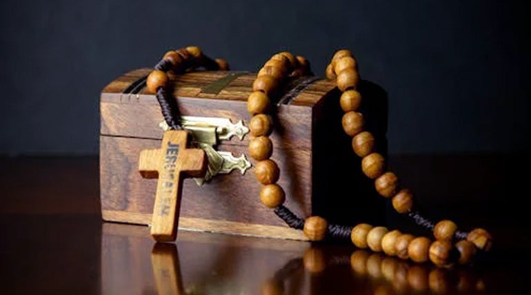 Jerusalem olive wood rosary on a wooden box