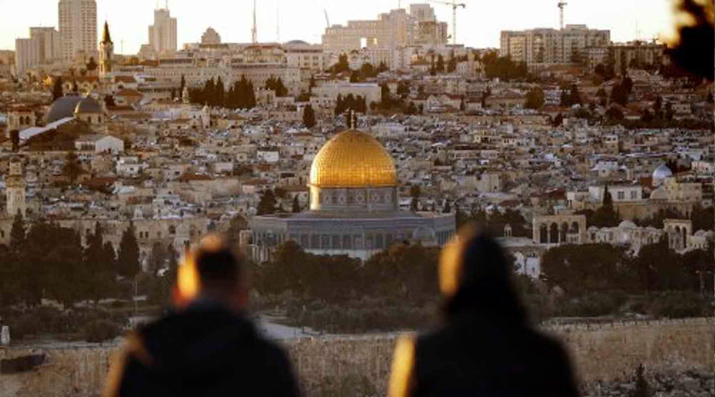Landscape of Jerusalem with two people looking at the Dome of Rock in background