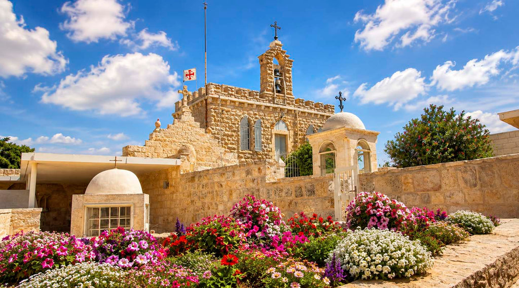 Church entrance with flowers and blue sky withsome clouds