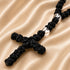 Black cord Chotki with knotted cross on creamy cloth
