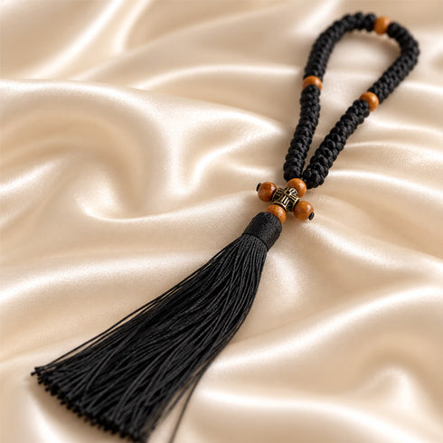 Black 50-knot Chotki arranged to show wooden beads and bronze-tone cross