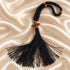 Detailed view of a black 50-knot Chotki prayer rope with wooden bead accents