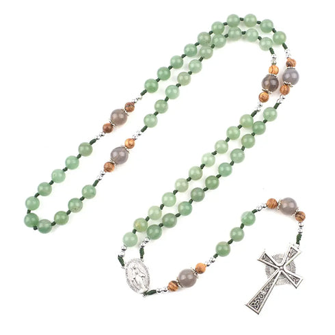 Handmade green gemstone rosary featuring a Celtic cross and a Miraculous Virgin Mary centrepiece.