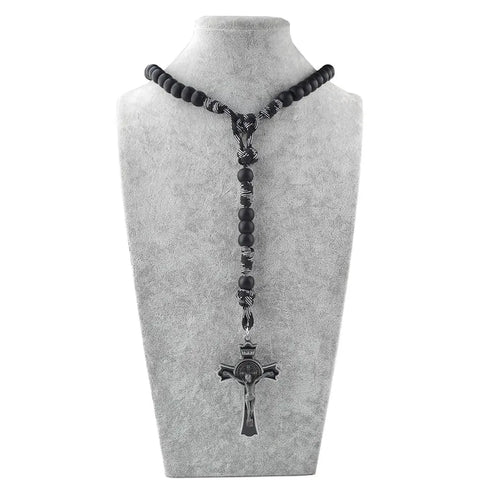 A rugged black paracord rosary with matte acrylic beads and a stainless steel St. Benedict crucifix.