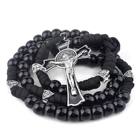 A rugged black paracord rosary with acrylic beads and a stainless steel St. Benedict crucifix.