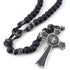 Durable man's rosary with matte black 12mm beads and Saint Benedict crucifix, against white background.