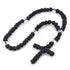 Tightly knotted black Orthodox Chotki prayer rope on white background.