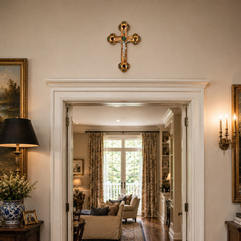 Living room with a cross on the wall, lamp, and view into another room.