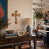 Living room with a wooden console table, books, a lamp, and decorative items.