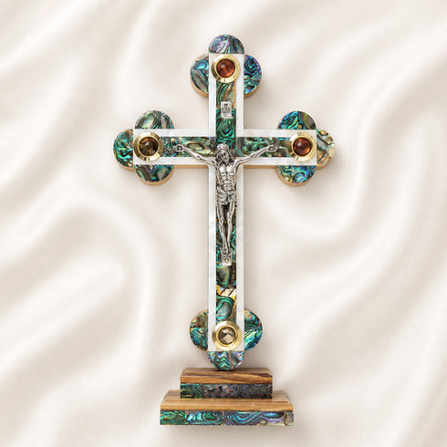 Budded standing olive wood cross with mother of pearl, silver crucifix, and four embedded holy elements from the Holy Land.