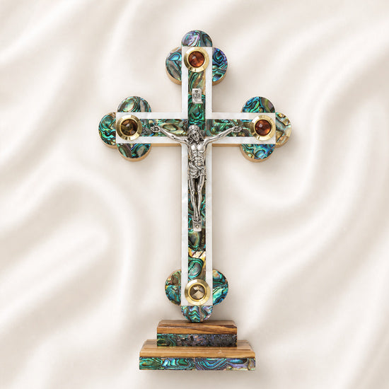 Budded standing olive wood cross with mother of pearl, silver crucifix, and four embedded holy elements from the Holy Land.
