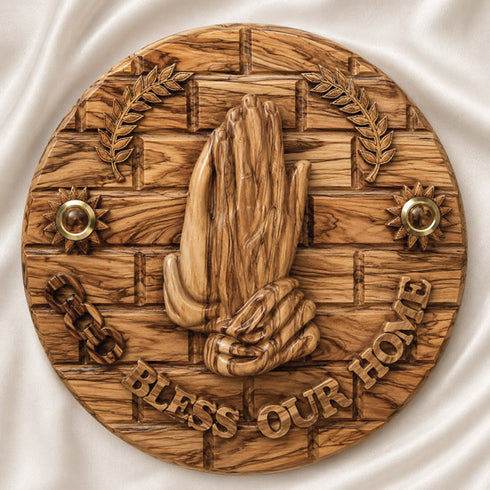 Olive wood blessing plate to hang on a wall with 'God Bless Our Home' inscription, praying hands and Holy Soil shown in detail.