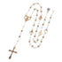 Elegant white pearl rosary with gold cross and engraved heart charm on white background.