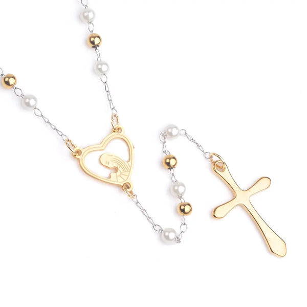 A gold-plated stainless steel rosary with white pearls, featuring an engraved heart and a cross.