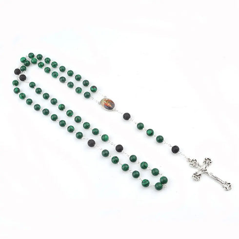 Malachite rosary with 8mm lava stone accents and Holy Family emblem, laid on white background.