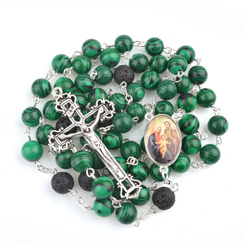 Malachite 8mm bead rosary with lava stone accents and Holy Family centrepiece, against white background.