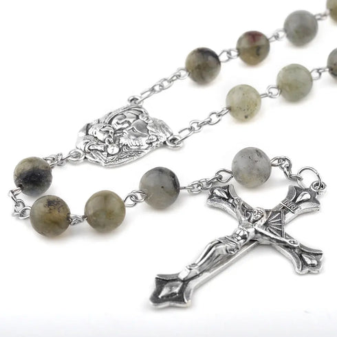 Labradorite 8mm bead rosary with antique silver Holy Family centrepiece and crucifix on a white background.