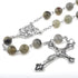 Labradorite 8mm bead rosary with antique silver Holy Family centrepiece and crucifix on a white background.
