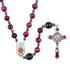 Rosary featuring red Tiger Eye beads, a Child Jesus center medal and a red St.Benedict crucifix, against white backdrop.