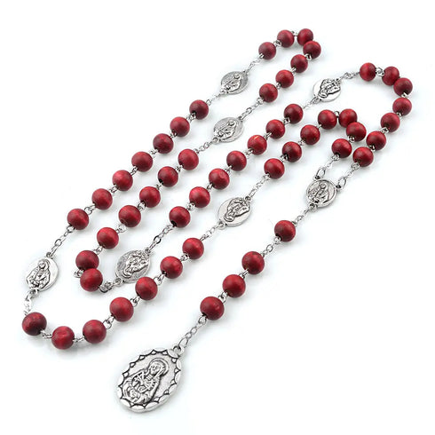 Seven Sorrows chaplet rosary with rose-scented 8mm wooden beads on white background.