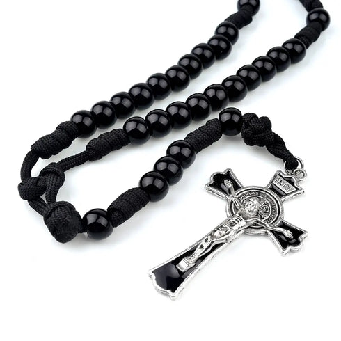 Men’s 12mm black acrylic rosary with paracord and St. Benedict cross, against white background.