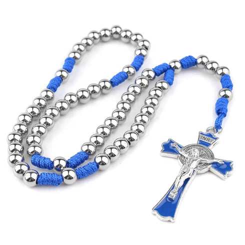 St.Benedict stainless steel crucifix rosary with blue cording and silver beads on white background.