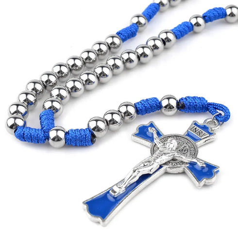 Blue corded rosary with stainless steel beads and Benedict cross, laid on white background.