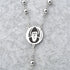 Stainless steel rosary with St. Charbel medal displayed on a clean grey background.
