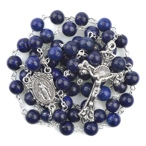 Lapis Lazurite Rosary with Virgin Mary centrepiece and antique silver-plated crucifix on white background.
