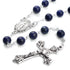 Lapis Lazurite Rosary with Virgin Mary centrepiece and antique silver-plated crucifix on white background.