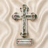 Decorative cross with Jerusalem label on a beige fabric background