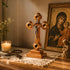 Standing wooden crucifix with Four Elements in a religious ambient