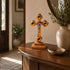 Standing wooden crucifix on a table near entrance door