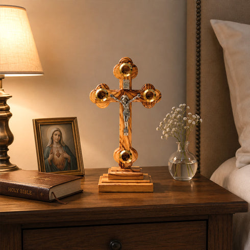 Altar wooden crucifix with Four Elements in on a night table