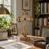 Olive wood Apostles crucifix displayed in a cozy reading room with books, framed art and warm furnishings