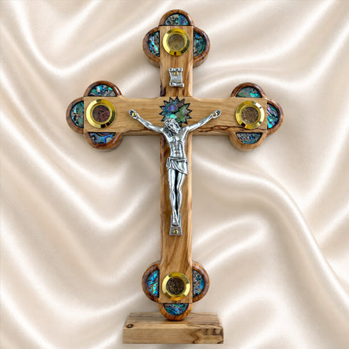 Handcrafted olive wood Apostles crucifix with a silver-tone corpus and decorative details from the Holy Land