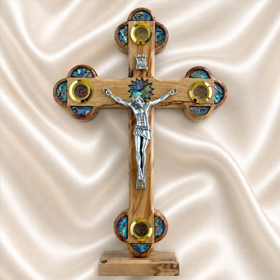 Handcrafted olive wood Apostles crucifix with a silver-tone corpus and decorative details from the Holy Land