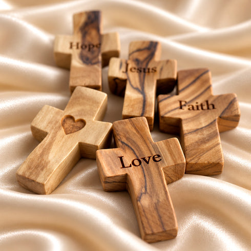 Set of handmade Bethlehem olive wood comfort crosses in different devotional designs