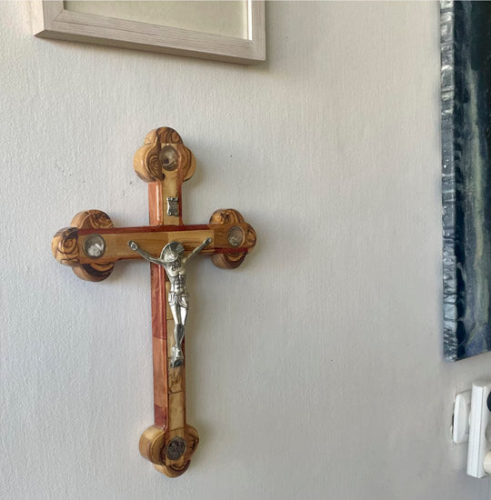 Extra large Orthodox olive wood cross with Four Elements and iron crucifix hanging on the wall.