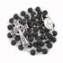 Black lava stone rosary with silver Celtic crucifix and Miraculous medal on a white background
