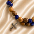 Men's beaded wrap bracelet with olive wood beads, dark blue crystal accents, cross charm