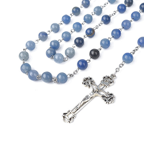 Blue beaded rosary with a silver cross on a white background