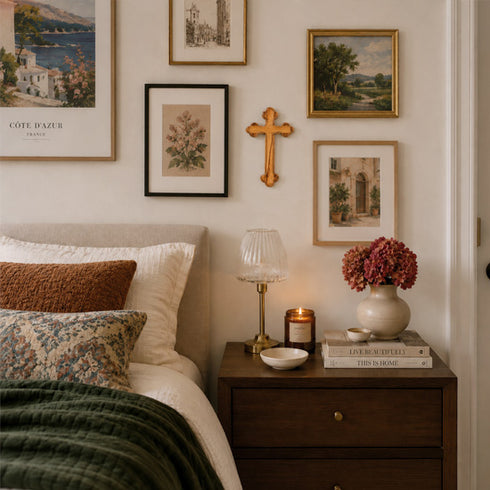 Cozy bedroom with bed, nightstand, and wall art