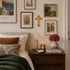 Cozy bedroom with bed, nightstand, and wall art