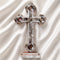 A handmade standing olive wood cross with mother of pearl decor, with Four Elements and a silver-tone crucifixion figure.