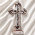 A handmade standing olive wood cross with mother of pearl decor, with Four Elements and a silver-tone crucifixion figure.